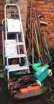 A large quantity of garden tools, to include spades, hoes, rakes, A frame stepladders, tool boxes, e