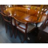 A mahogany and cross banded oval extending twin pedestal dining table, 80cm high, the top 140cm x 10