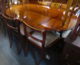 A mahogany and cross banded oval extending twin pedestal dining table, 80cm high, the top 140cm x 10