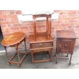 A group of furniture, to include nest of two tables, oak pot cupboard, oak side table, with carved d