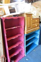 A group of furniture to include a pink painted open bookcase, two painted French style bedside table