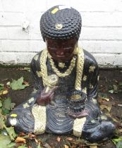 A composition painted garden statue, modelled as a seated Buddha, 47cm high.