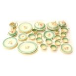 A Susie Cooper part dinner and tea service, printed and painted with flowers within green bands, sta