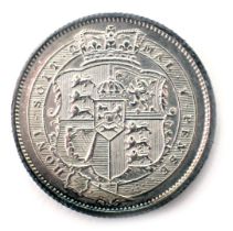 A George III 1820 silver shilling coin.