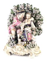 A Continental Derby style porcelain figure group, modelled in the form of a gentleman and lady playi