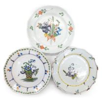 Three 18thC French Faience plates, each decorated with flowers, one with basket of flowers, various