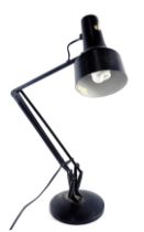 A black enamel painted Anglepoise type lamp, on domed foot.