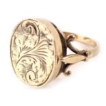 A 9ct gold snuff taking ring, the oval locket ring head with floral design, with V splayed shoulders