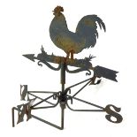 A 20thC black painted weather vane, decorated with a chicken, 38cm wide.