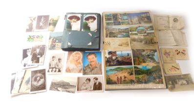 An album of early 20thC postcards and greetings cards, to include real photos, actresses, Princess M