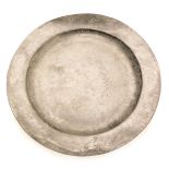 A late 18th/early 19thC pewter plate or charger, indistinct touch marks, 38cm diameter.