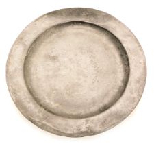 A late 18th/early 19thC pewter plate or charger, indistinct touch marks, 38cm diameter.