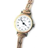An Excalibur ladies wristwatch, in a gold plated case, with stainless steel back numbered 6002, on a