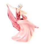 A Katzhutte German Art Deco figure of a lady, in pink flowing dress, with green stamp to underside,