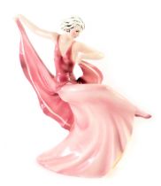 A Katzhutte German Art Deco figure of a lady, in pink flowing dress, with green stamp to underside,