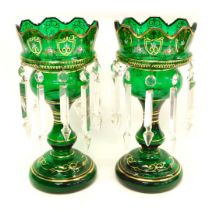 A pair of Victorian green tinted glass table lustres, each decorated in raised enamels and gilt with