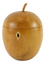 A turned fruitwood tea caddy, modelled in the form of an apple, probably late 20thC/early 21stC, 15c