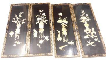 A set of four Oriental lacquer panels, each inset with mother of pearl, Shiboyama vases of flowers,