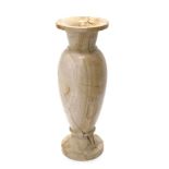 A large turned stone vase, with brown marble type configuration, 74cm high.