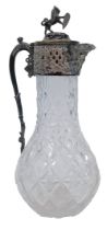A Victorian pressed glass and silver plated claret jug, the hinged lid with applied rearing lion and