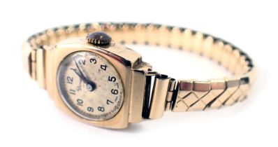 A 9ct gold cased Pioneer lady's wristwatch, with a silvered numeric dial, in square case, 1.5cm wide