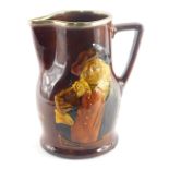 A Royal Doulton whisky jug, decorated with a figure with a book, and with raised slipware motto Thou