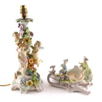 A German porcelain table lamp, modelled with putty, flowers, etc., (AF), 40cm high overall, and a Tr
