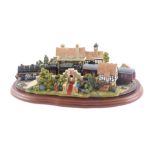 A large Lilliput Lane model of The Royal Train at Sandringham, on a shaped mahogany base, 32cm long.