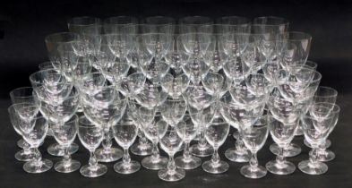 A large part suite of plain glasses with baluster stems, various sizes.