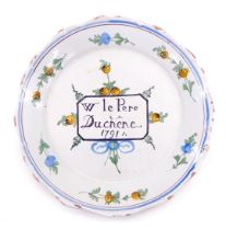 An 18thC French Faience commemorative plate, titled W Le Pere Duchene 1791, 22cm diameter. (AF)