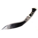 A Nepalese or Indian kukri, with horn handle, plated mounts and blade, lacking scabbard, 81cm long.