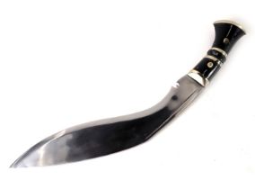 A Nepalese or Indian kukri, with horn handle, plated mounts and blade, lacking scabbard, 81cm long.