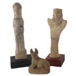 Three ancient figures, comprising an Egyptian figure of Anubis, a Syrro Hittite bird headed figure a
