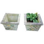 A pair of reconstituted stone lattice square garden planters, the moulded border on painted cross ha