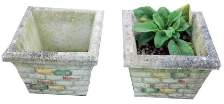 A pair of reconstituted stone lattice square garden planters, the moulded border on painted cross ha