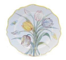 A 19thC Porquier Beau Faience botanical plate, decorated with insect, 25cm diameter. (AF)