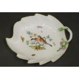 A Meissen porcelain leaf shaped dish, decorated with birds on a branch, insects, etc., with stylised