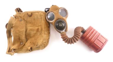 A WWII respirator or gas mask, with labels stating worn by W L Wood of 142 Heanor Road, Smalley for