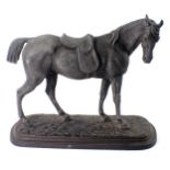 A cast spelter figure of a standing horse, on painted mottled decoration, on oval base, 25cm high. (