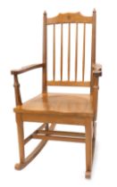 An Alan 'Acornman' Grainger oak rocking chair, with spindle turned back, solid seat and shaped arms,