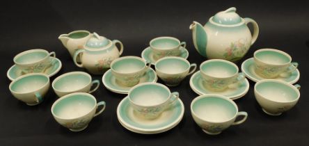 A Susie Cooper flower printed part tea service, the teapot with kestrel beak spout, to include cups
