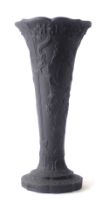 A Wedgwood black basalt trumpet shaped vase, with buckle and floral design, 24cm high.