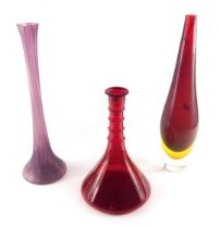 A large clear red and yellow slender Art Glass vase, 50cm high, a ship's decanter shaped ruby tinted
