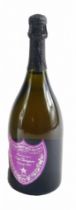 A bottle of special edition Andy Warhol Dom Perignon vintage 2002 champagne, with purple label,
