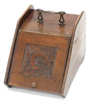 A late Victorian walnut coal scuttle, with bronzed metal handle and carved lid, 31cm wide.