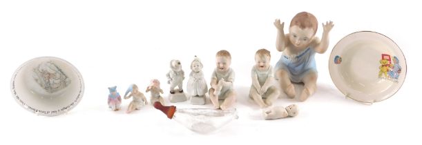 A large bisque piano baby, various piano babies, figures, a Wedgwood Old Mrs Rabbit bowl, and a baby