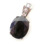 A sapphire and diamond pendant, the oval cut sapphire 15mm x 12mm x 4mm, in four double claw setting