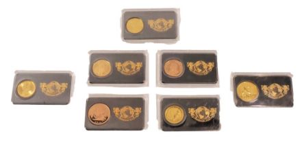 The London Mint Office Magnificent Seven coin set, comprising a 2016 half gold sovereign, the Austra