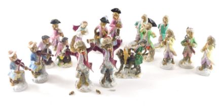 A collection of monkey band figures, to include two conductors, a figure seated on another monkey pl