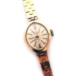 A 9ct gold Avia ladies wristwatch, the diamond shaped watch head on silvered dial, 1.5cm high, 15.5g